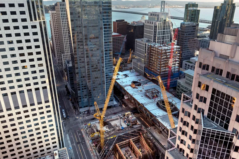 View looking down on construction of multiple buildings in San Francisco's Transbay Transit Center District